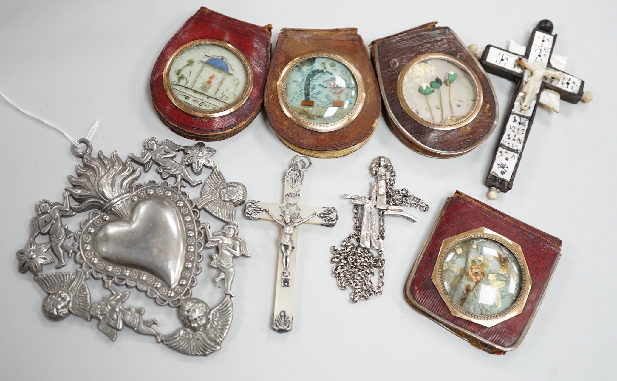 A group of catholic related collectables including Corpus Christi, rosary bead holders etc.